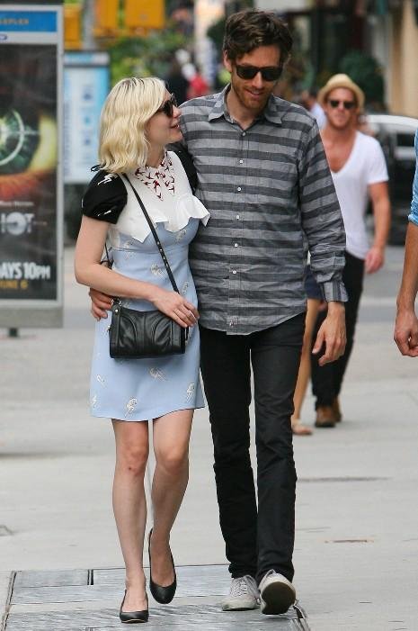 Kirsten Dunst, 28, seems quite content with her rock star boyfriend Jason 