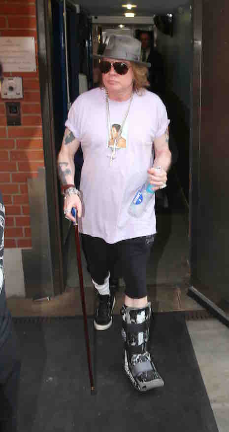 Axl Rose greets his fans leaving his London Hotel